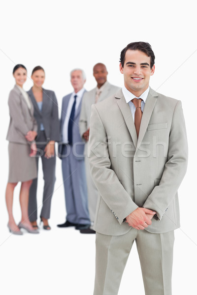 Om de afaceri echipă in spatele alb afaceri costum Imagine de stoc © wavebreak_media