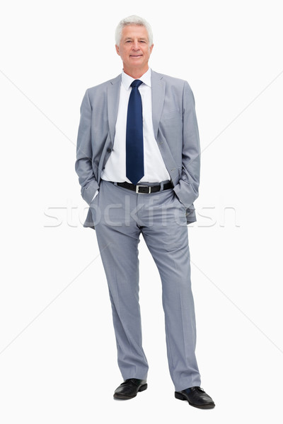 Portrait of a man in a suit with hands in the pockets against white babckground Stock photo © wavebreak_media