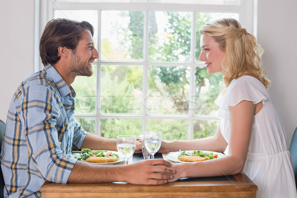 かわいい 笑みを浮かべて カップル 食事 一緒に ホーム ストックフォト © wavebreak_media
