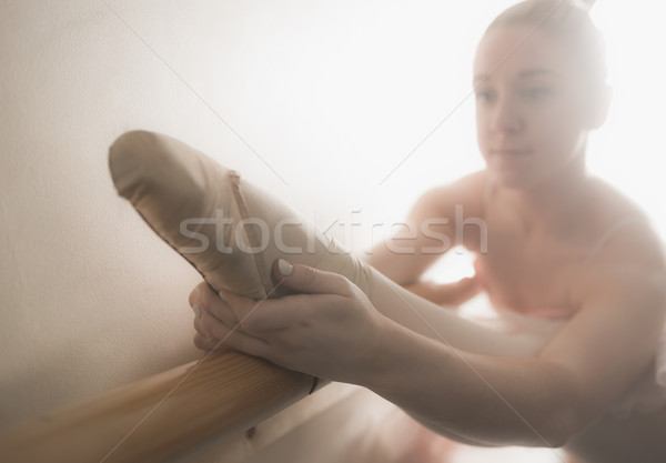 Beautiful ballerina warming up with the barre Stock photo © wavebreak_media