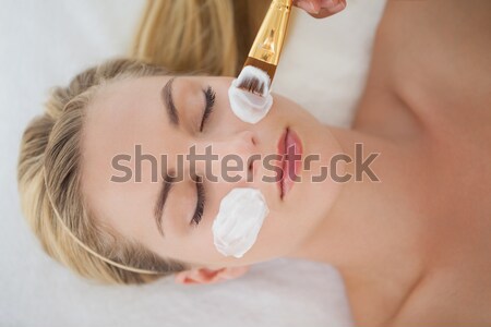 Stock photo: Beautiful blonde getting a facial treatment