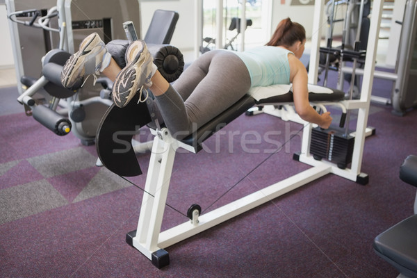 Fit brunette using weights machine for legs Stock photo © wavebreak_media