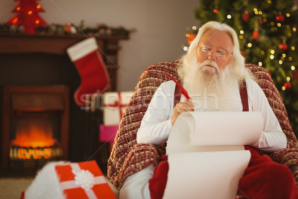 Relaxed santa writing list with a quill Stock photo © wavebreak_media
