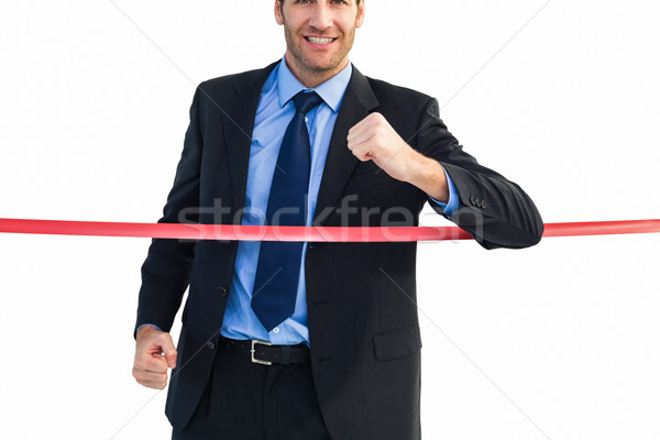 Stock photo: Happy businessman crossing finishing line