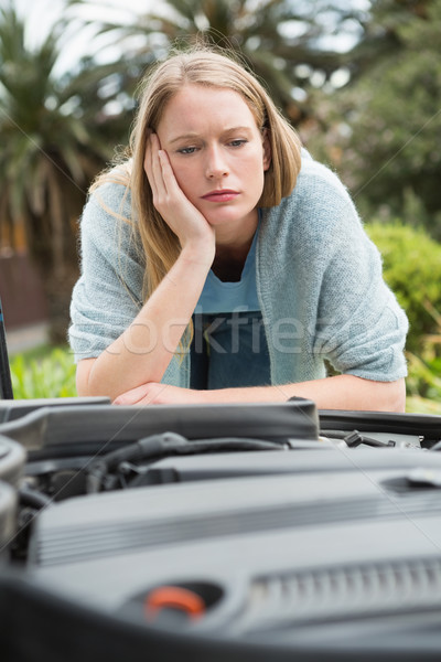 Thoughtful woman looking at engine  Stock photo © wavebreak_media
