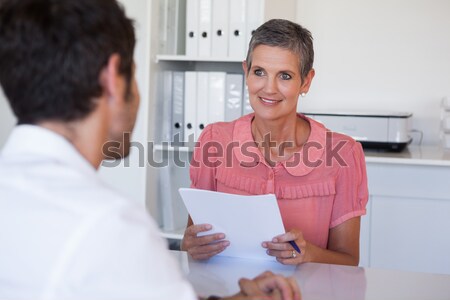 Business people working together on laptop and smiling Stock photo © wavebreak_media