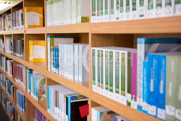  Volumes of books on bookshelf in library  Stock photo © wavebreak_media