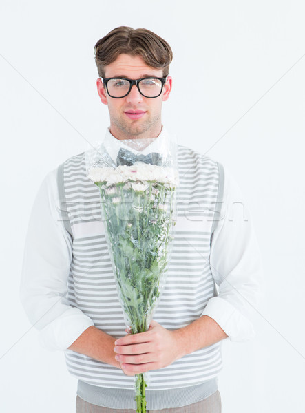 Geeky hipster offering bunch of flowers Stock photo © wavebreak_media