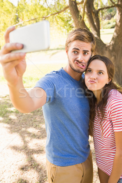 Cute couple doing selfie in the park Stock photo © wavebreak_media