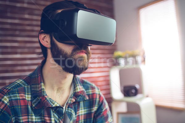 Smart creative businessman wearing 3D video glasses Stock photo © wavebreak_media