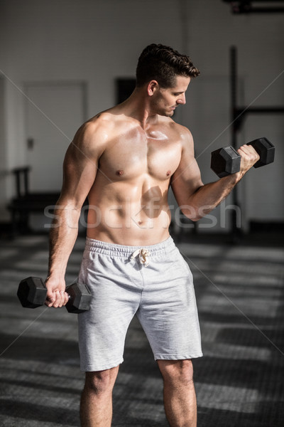 Muscular serious man doing weightlifting Stock photo © wavebreak_media