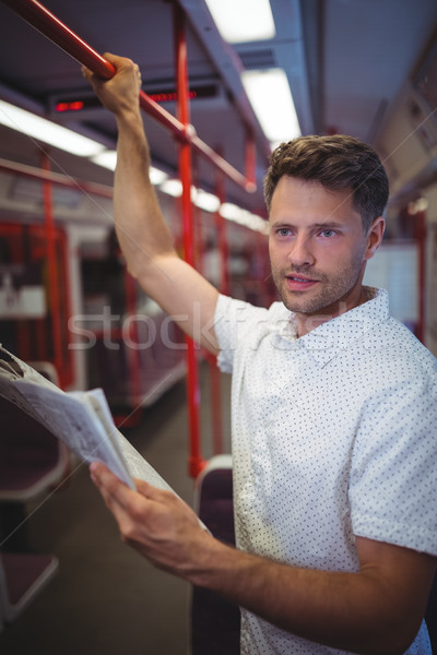 [[stock_photo]]: Bel · homme · écouter · musique · téléphone · portable · train · chien