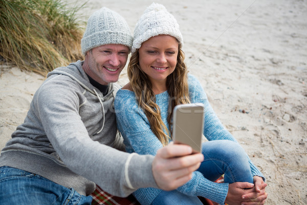 Happy couple taking a selfie from mobile phone Stock photo © wavebreak_media