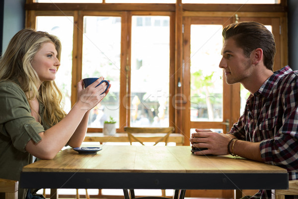 Loving young couple having coffee in cafeteria Stock photo © wavebreak_media