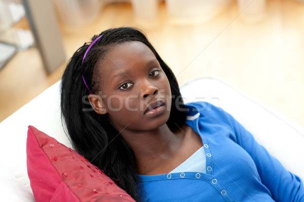 Portrait of an upset woman lying on a sofa Stock photo © wavebreak_media