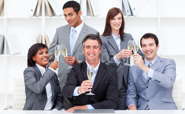 Positive business people toasting with Champagne Stock photo © wavebreak_media