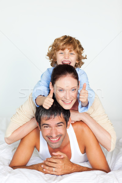 Parents and son playing in bed Stock photo © wavebreak_media