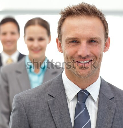 Three happy partners posing in a row in the office Stock photo © wavebreak_media