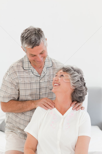 Retired man giving a massage to his wife at home Stock photo © wavebreak_media