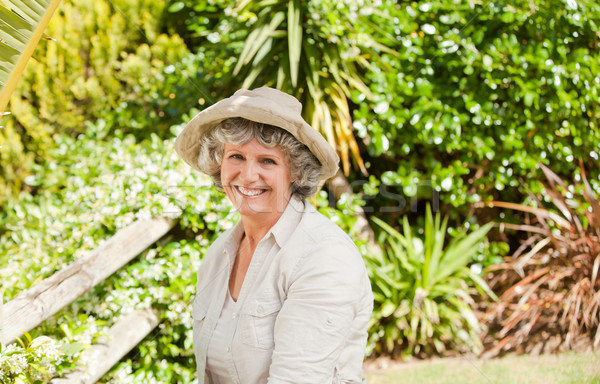 Pretty senior woman looking at the camera Stock photo © wavebreak_media