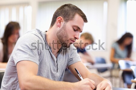 Students having a test in a classroom Stock photo © wavebreak_media