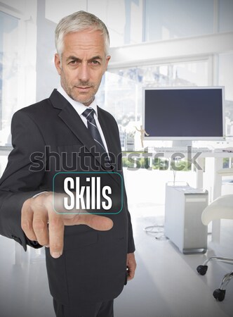 Smiling mature tradesman presenting screen of his tablet computer against a white background Stock photo © wavebreak_media