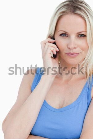 Nő néz kamera beszél telefon fehér Stock fotó © wavebreak_media