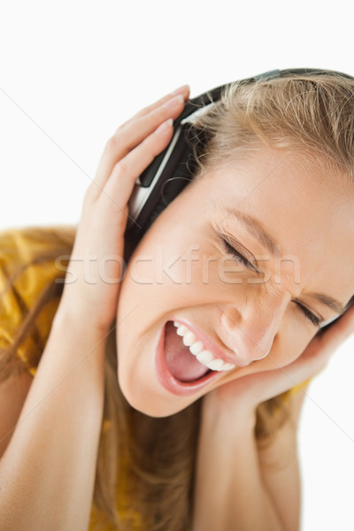Mulher loira música fones de ouvido branco Foto stock © wavebreak_media
