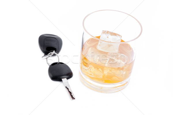 Car key and a whiskey against a white background Stock photo © wavebreak_media