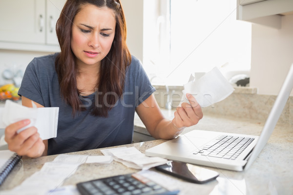 Young woman getting stressed over finances in kitchen Stock photo © wavebreak_media
