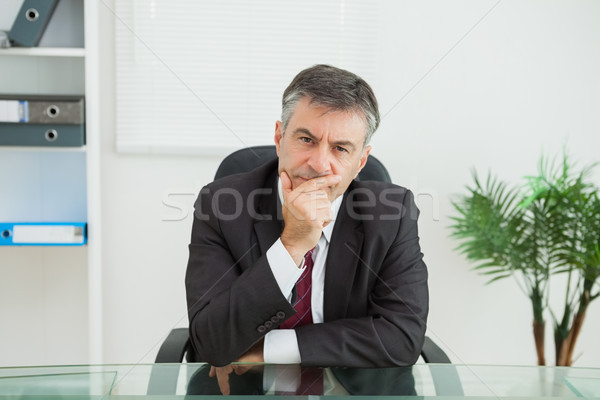 Sitting businessman looking thoughtfully in his office Stock photo © wavebreak_media
