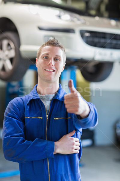 Happy male mechanic gesturing thumbs up Stock photo © wavebreak_media