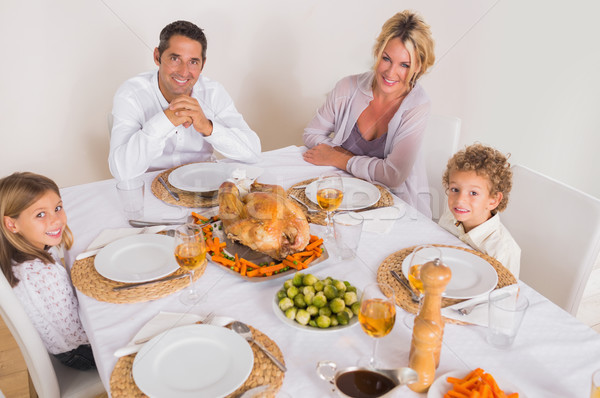 Famiglia sorridere in giro cena tavola ragazza Foto d'archivio © wavebreak_media