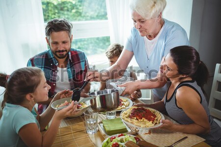 Stock photo: Editor picking photographs in a meeting