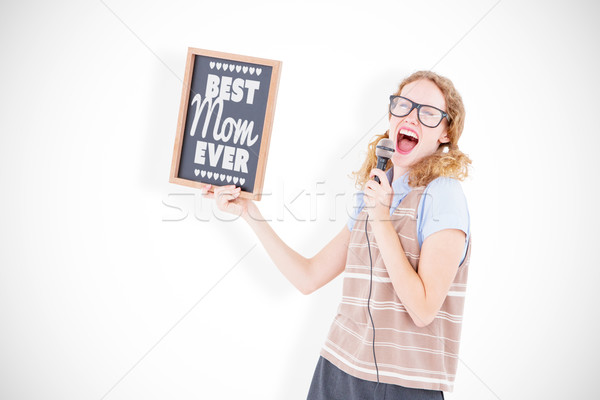Composite image of geeky hipster woman holding blackboard and si Stock photo © wavebreak_media
