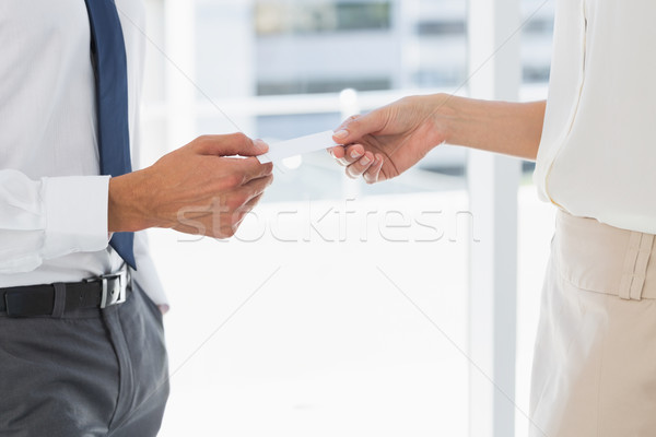 Mid section of executives exchanging business card Stock photo © wavebreak_media