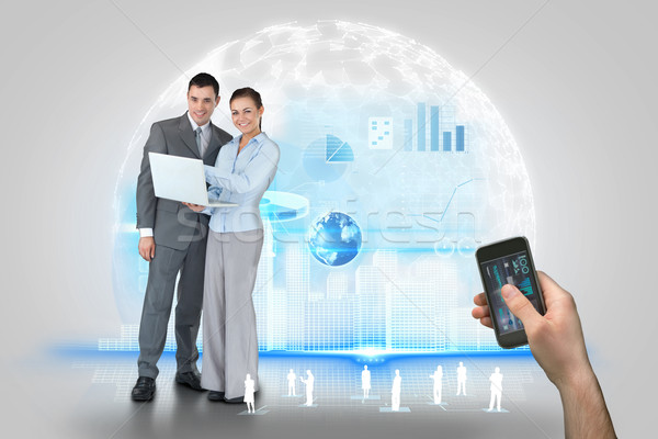 Kéz tart okostelefon interfész üzleti partnerek digitális kompozit Stock fotó © wavebreak_media
