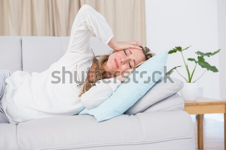 A sick man lying on the sofa Stock photo © wavebreak_media