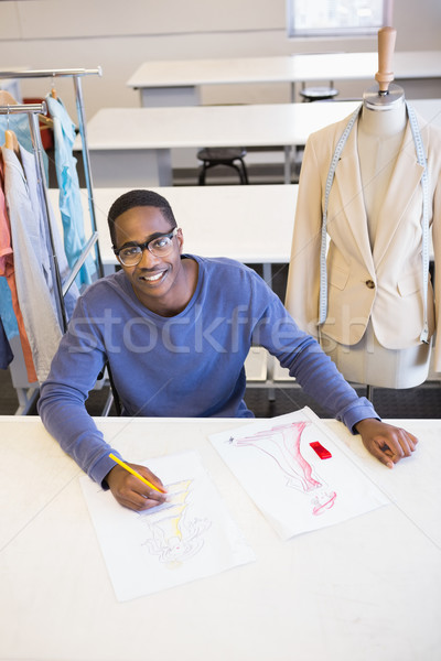 Smiling student drawing picture with colored pencil Stock photo © wavebreak_media