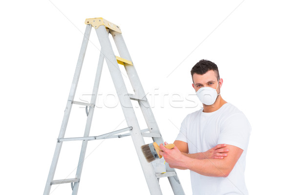 Stock photo: handyman with paintbrush and ladder 