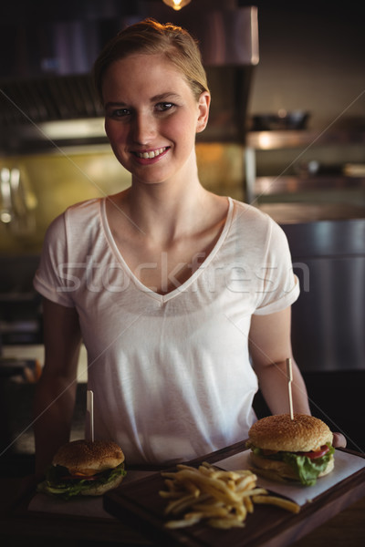 [[stock_photo]]: Belle · femme · Burger · frites · françaises · plateau · restaurant