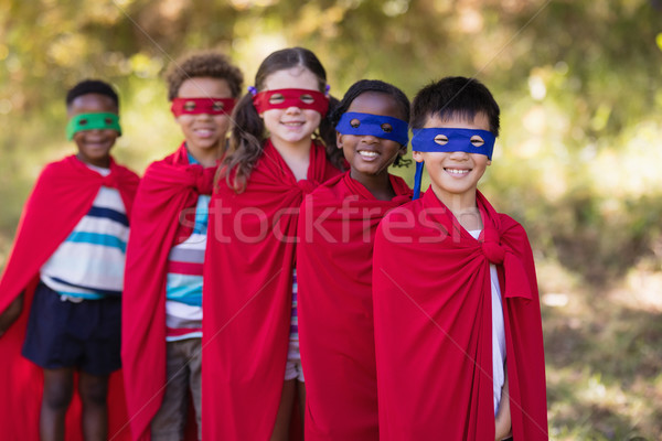 Friends in superhero costumes standing at campsite Stock photo © wavebreak_media