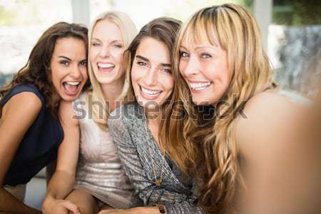 Portrait of smiling young female friends Stock photo © wavebreak_media