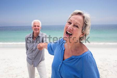 Portret starszy kobieta stałego morza plaży Zdjęcia stock © wavebreak_media