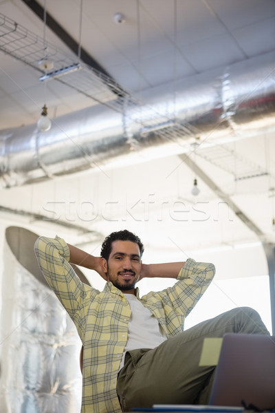Portrait of relaxed man on chair in office Stock photo © wavebreak_media
