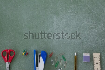 Various school supplies arranged on chalkboard Stock photo © wavebreak_media