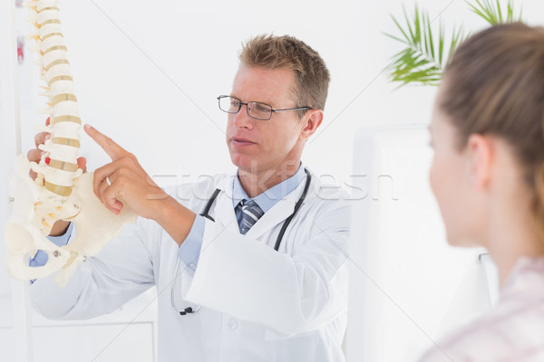 Doctor explaining anatomical spine to his patient Stock photo © wavebreak_media