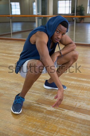 Tired male dancer with friend drinking water in studio Stock photo © wavebreak_media