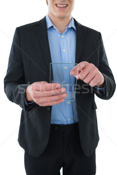 Mid section of smiling businessman using interface Stock photo © wavebreak_media