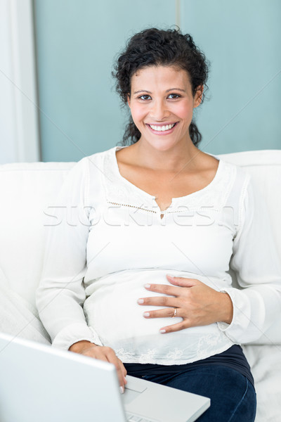 портрет женщину используя ноутбук счастливым беременная женщина сидят Сток-фото © wavebreak_media